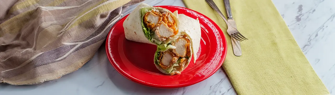 chicken snack wrap on a red plate